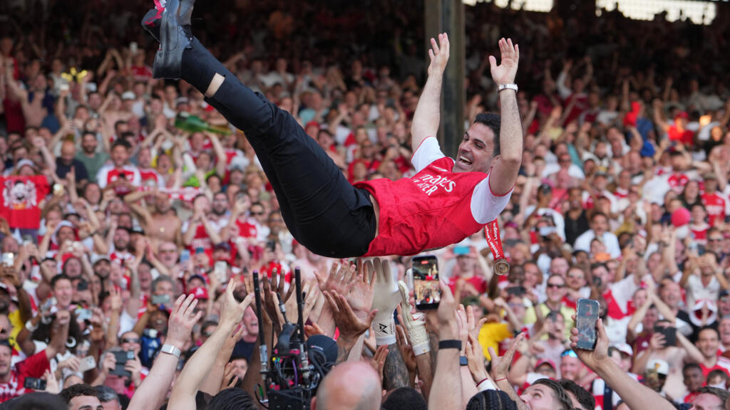 Arsenal head coach Mikel Arteta is carried in celebration by players after securing the Premier League title following the football match between Crystal Palace and Arsenal in London, England, on Sunday, 24 May 2026.
