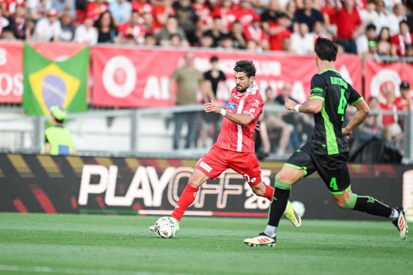Patrick Cutrone and Monza players celebrate their Serie A promotion despite a tense playoff finale against Catanzaro