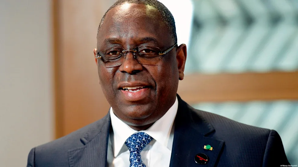 President Bassirou Diomaye Faye and former President Macky Sall shaking hands