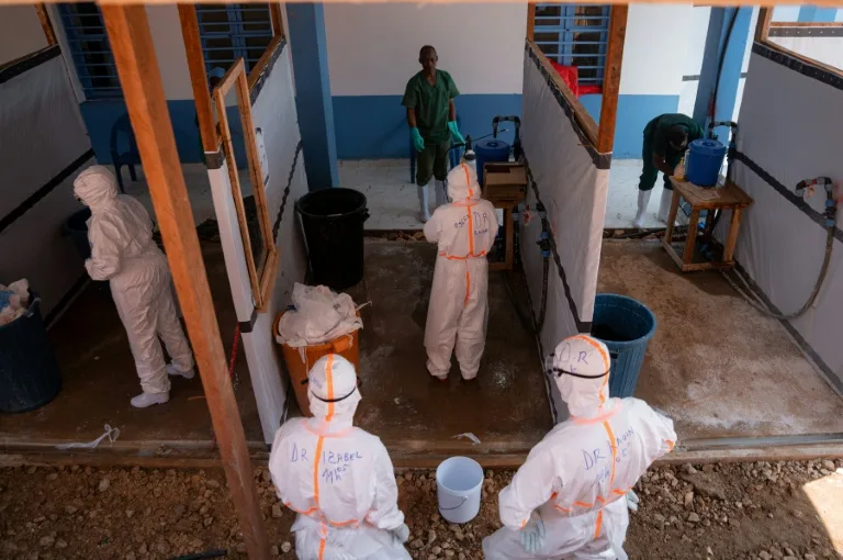 Healthcare workers in protective gear during an Ebola response drill